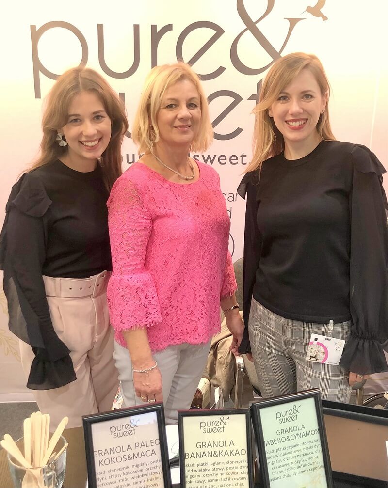 The Pure&Sweet team at a trade fair stand with granolas